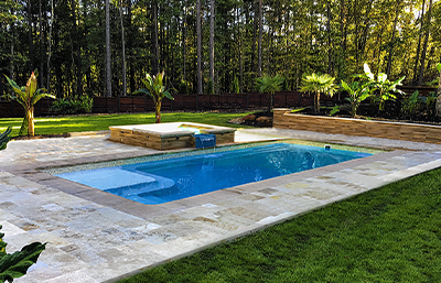 Rectangle Pool with built in tanning ledge and raised spa - Custom Fiberglass Pools Dealer - Custom Home Solutions - Knoxville TN Fiberglass Pool Builder